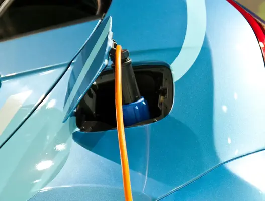 Blue electric car charging 