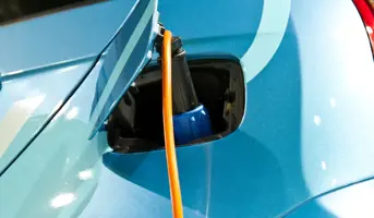 Blue electric car charging 
